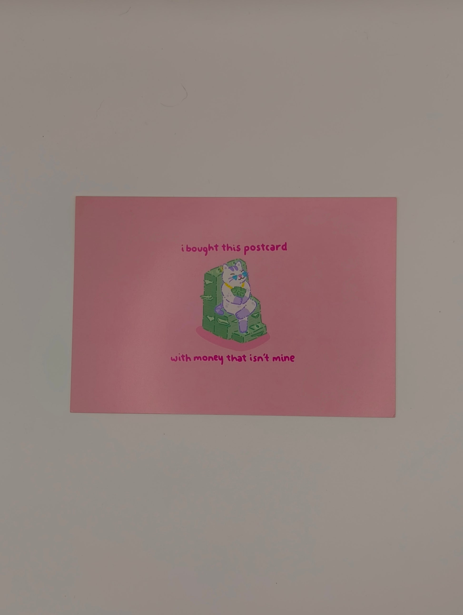 74 I bought this postcard with money that isn't mine